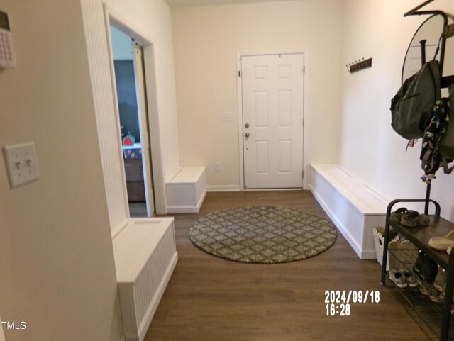 mudroom with baseboards and wood finished floors