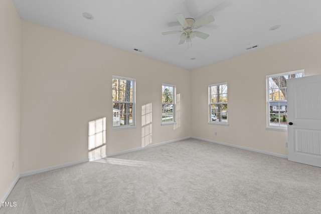 612 Lakeview Dr, Raleigh, NC 27603 - carpeted empty room featuring baseboards, healthy amount of natural light, and ceiling fan
