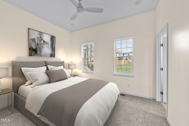 612 Lakeview Dr, Raleigh, NC 27603 - carpeted bedroom with baseboards and a ceiling fan