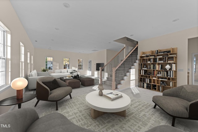 612 Lakeview Dr, Raleigh, NC 27603 - living area with carpet, healthy amount of natural light, and stairs