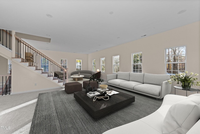 612 Lakeview Dr, Raleigh, NC 27603 - living area with carpet floors, stairway, and baseboards