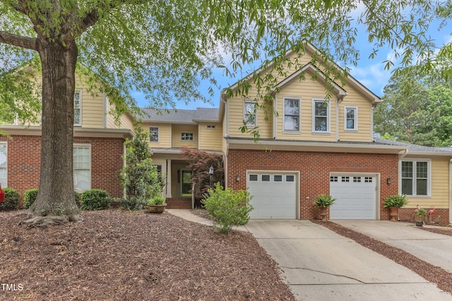 11035 Southwalk Ln, Raleigh, NC 27614 - view of front of house with driveway, a garage, and brick siding