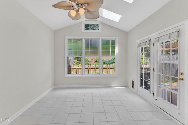 11035 Southwalk Ln, Raleigh, NC 27614 - empty room with a skylight, vaulted ceiling, ceiling fan, baseboards, and light tile patterned floors