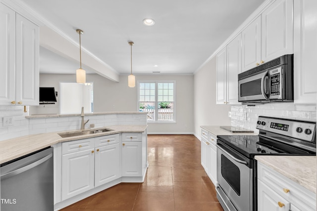 11035 Southwalk Ln, Raleigh, NC 27614 - kitchen with stainless steel appliances, a sink, white cabinets, recessed lighting, and ornamental molding
