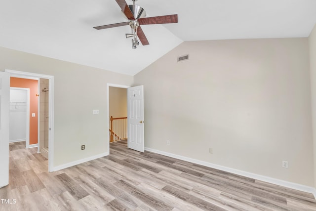11035 Southwalk Ln, Raleigh, NC 27614 - unfurnished bedroom with lofted ceiling, light wood-style floors, a walk in closet, baseboards, and a closet