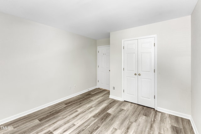 11035 Southwalk Ln, Raleigh, NC 27614 - unfurnished bedroom with light wood-style floors, baseboards, and a closet