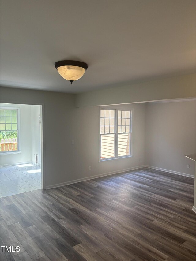 11035 Southwalk Ln, Raleigh, NC 27614 - unfurnished room with dark wood-style flooring and healthy amount of natural light