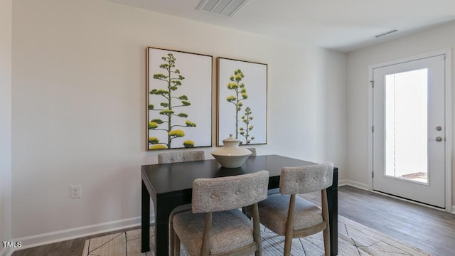 140 Holton St, Smithfield, NC 27577 - dining space featuring visible vents, baseboards, and light wood finished floors
