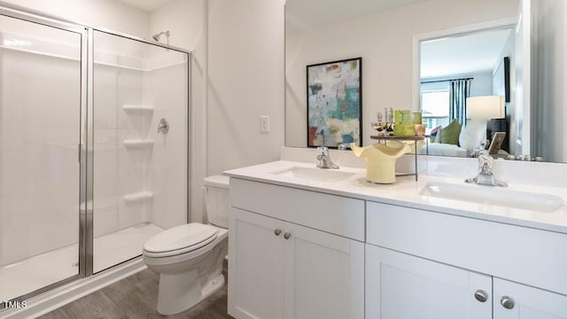 140 Holton St, Smithfield, NC 27577 - bathroom featuring a shower stall, toilet, ensuite bathroom, and a sink