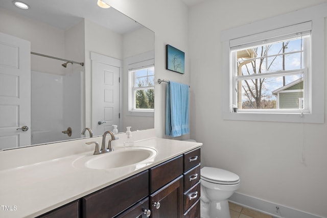 full bath featuring toilet, baseboards, tile patterned floors, and vanity