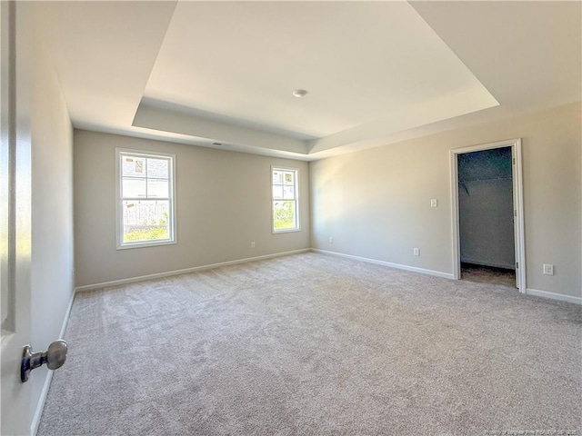 4010 Racking Horse Rd, Hope Mills, NC 28348 - unfurnished room with a tray ceiling, baseboards, and carpet floors