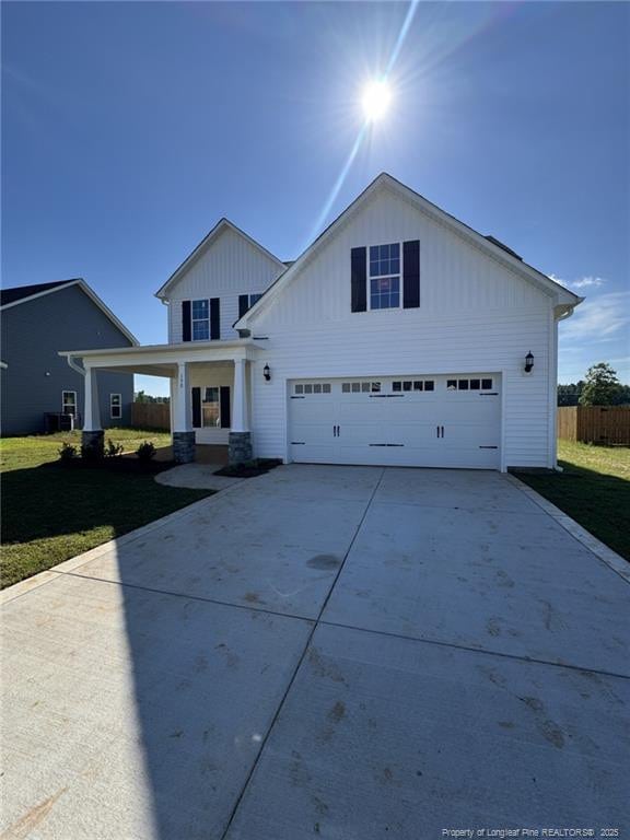 150 Ziggy Way, Raeford, NC 28376 - view of front of property featuring concrete driveway, a garage, and board and batten siding