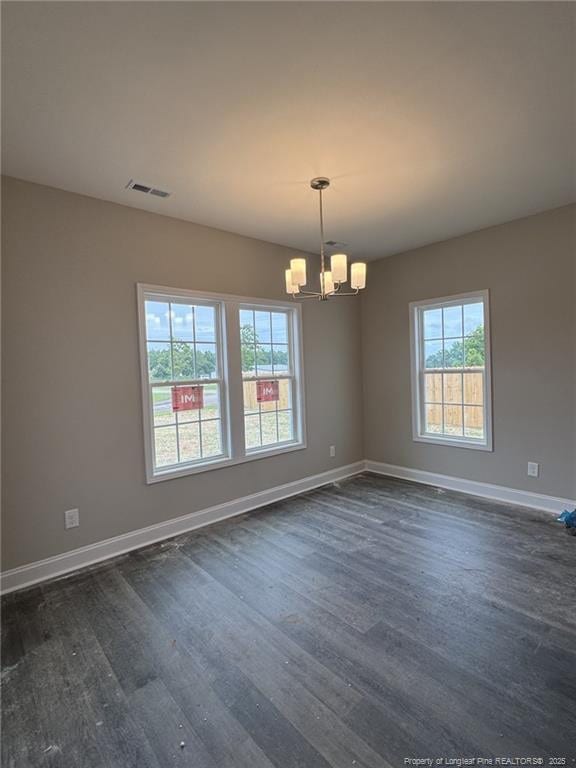 150 Ziggy Way, Raeford, NC 28376 - unfurnished room featuring a chandelier and dark wood-style floors