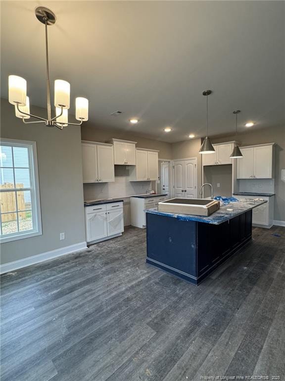 150 Ziggy Way, Raeford, NC 28376 - kitchen featuring a chandelier, dark wood finished floors, recessed lighting, a center island with sink, and white cabinets