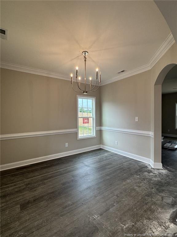 150 Ziggy Way, Raeford, NC 28376 - empty room with arched walkways, a chandelier, ornamental molding, and dark wood-style flooring