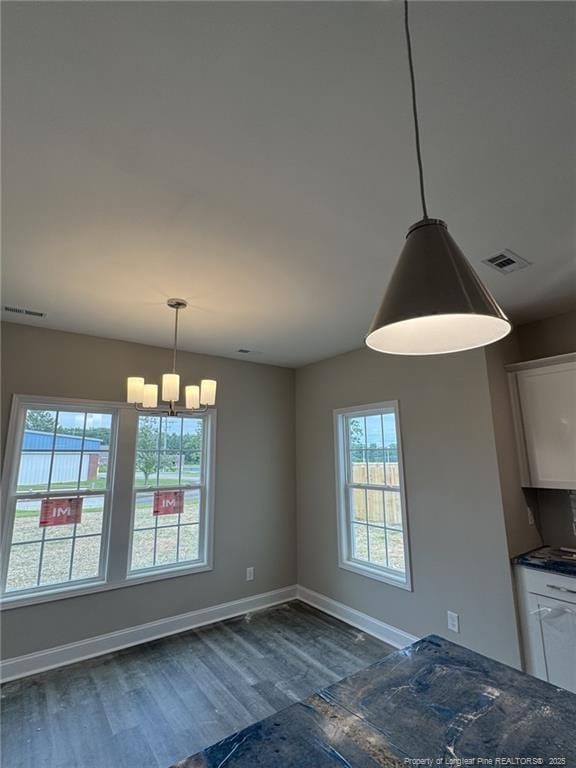 150 Ziggy Way, Raeford, NC 28376 - unfurnished dining area featuring a chandelier and dark wood-type flooring