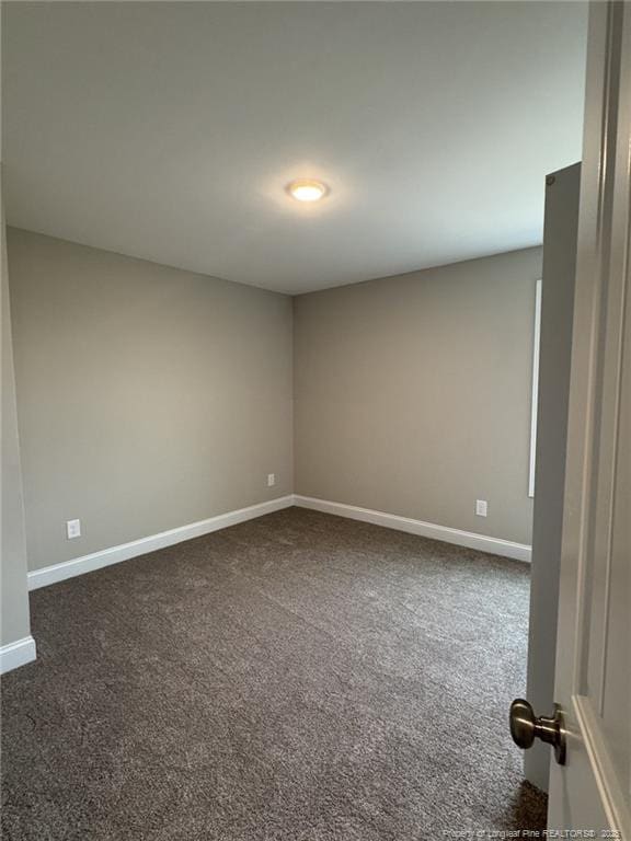 150 Ziggy Way, Raeford, NC 28376 - empty room with baseboards and dark colored carpet