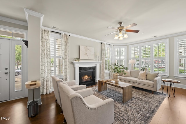 10529 Sablewood Dr Unit 111, Raleigh, NC 27617 - living room with ornamental molding, dark wood-type flooring, ceiling fan, and a fireplace with flush hearth
