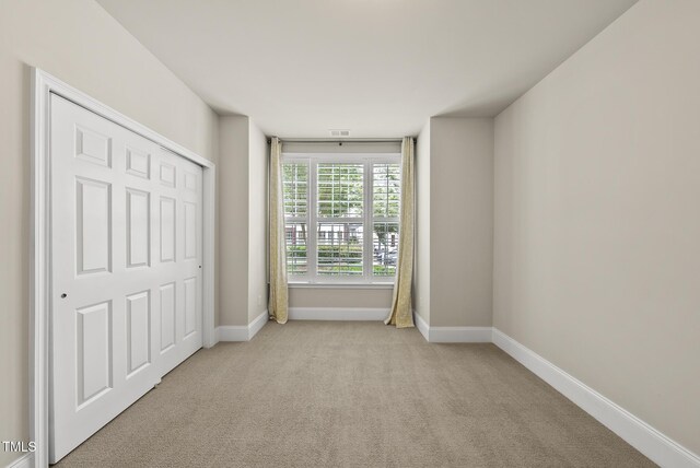10529 Sablewood Dr Unit 111, Raleigh, NC 27617 - unfurnished bedroom featuring carpet floors and baseboards