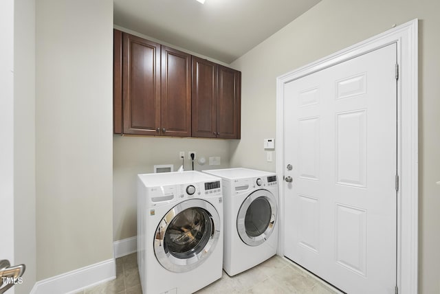 10529 Sablewood Dr Unit 111, Raleigh, NC 27617 - laundry room with cabinet space, washer and dryer, light tile patterned flooring, and baseboards