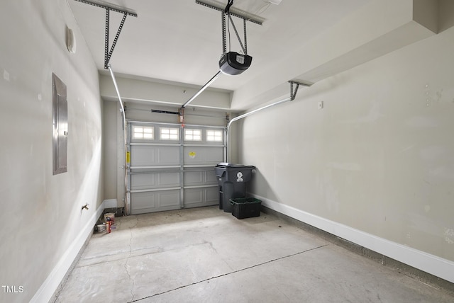 10529 Sablewood Dr Unit 111, Raleigh, NC 27617 - garage with a garage door opener, baseboards, and electric panel