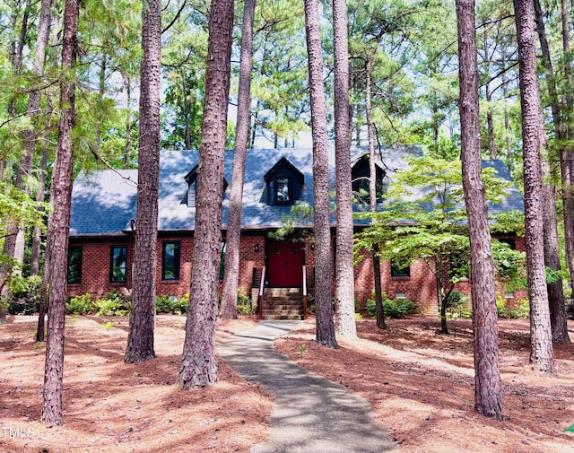 917 Queensferry Rd, Cary, NC 27511 - view of front facade with brick siding and a shingled roof