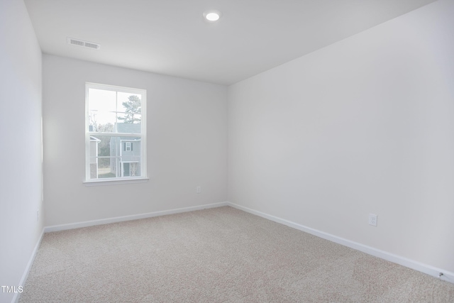 spare room featuring visible vents, baseboards, carpet, and recessed lighting