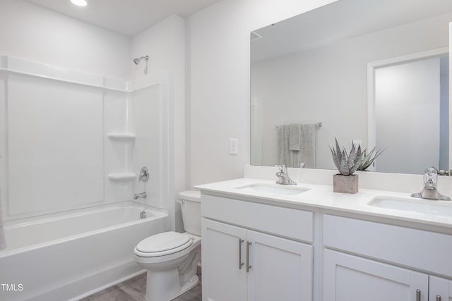 full bath featuring a sink, toilet, double vanity, and shower / tub combination