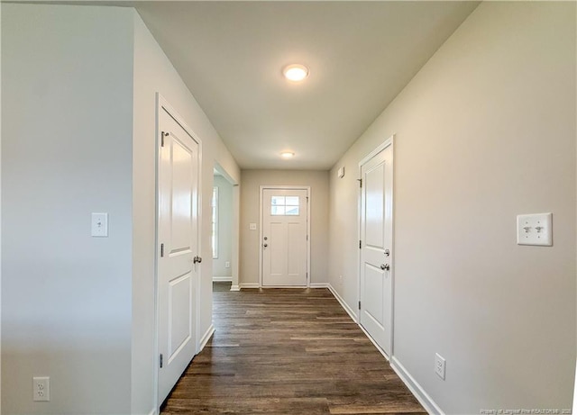 2224 Roadster Pony Rd, Hope Mills, NC 28348 - doorway to outside with dark wood-type flooring and baseboards