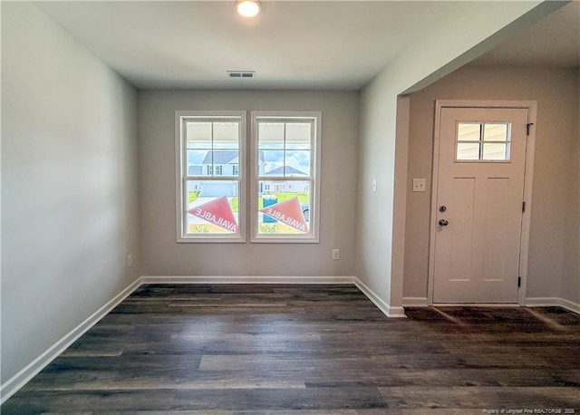 2224 Roadster Pony Rd, Hope Mills, NC 28348 - foyer entrance featuring dark wood-type flooring and baseboards