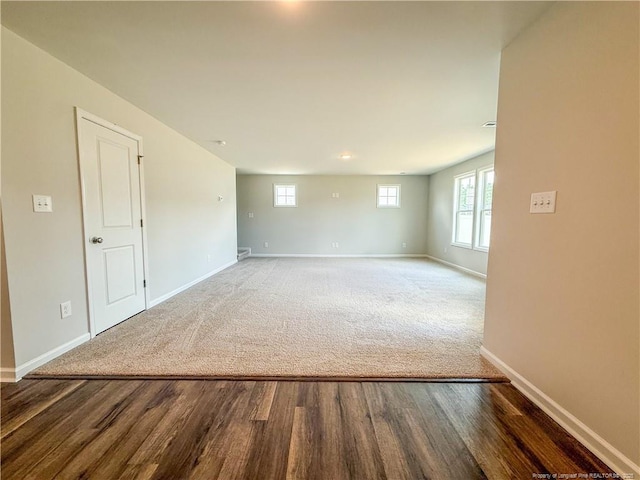 2224 Roadster Pony Rd, Hope Mills, NC 28348 - carpeted empty room featuring wood finished floors and plenty of natural light