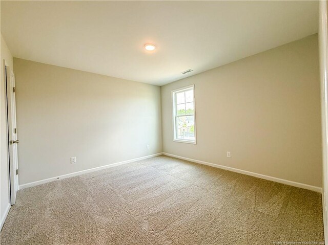 2224 Roadster Pony Rd, Hope Mills, NC 28348 - empty room with baseboards and light carpet
