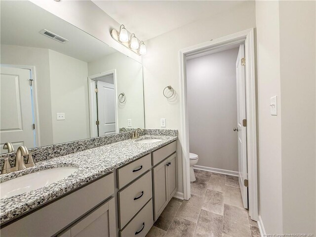 2224 Roadster Pony Rd, Hope Mills, NC 28348 - full bathroom with double vanity and stone finish flooring