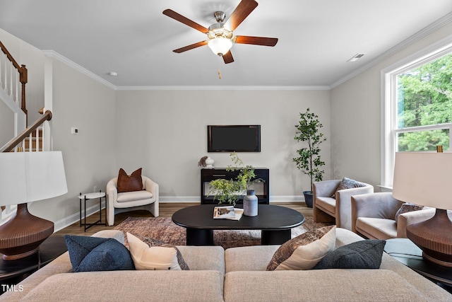 20 Diamond Creek Dr, Zebulon, NC 27597 - living room with a ceiling fan, wood finished floors, stairway, and crown molding
