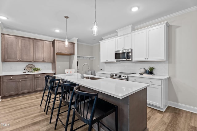 20 Diamond Creek Dr, Zebulon, NC 27597 - kitchen with stainless steel appliances, tasteful backsplash, crown molding, light countertops, and a kitchen breakfast bar