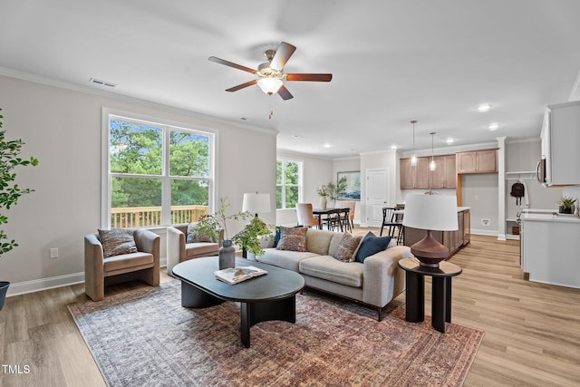 20 Diamond Creek Dr, Zebulon, NC 27597 - living area featuring light wood finished floors, a ceiling fan, ornamental molding, and recessed lighting