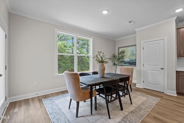 20 Diamond Creek Dr, Zebulon, NC 27597 - dining space featuring light wood finished floors, crown molding, plenty of natural light, and recessed lighting