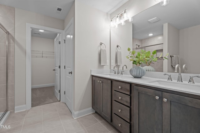 20 Diamond Creek Dr, Zebulon, NC 27597 - full bath featuring a shower stall, double vanity, tile patterned floors, and a spacious closet