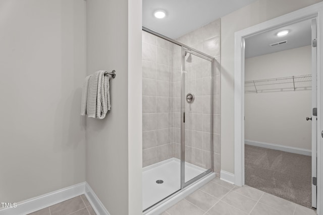20 Diamond Creek Dr, Zebulon, NC 27597 - full bath with a stall shower, a spacious closet, and tile patterned flooring