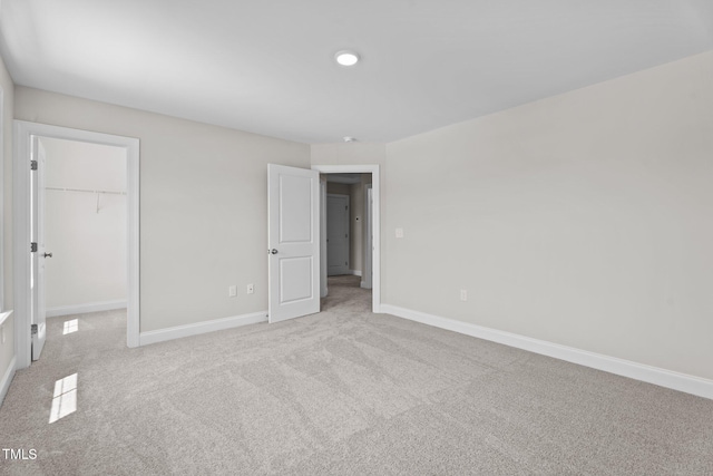 20 Diamond Creek Dr, Zebulon, NC 27597 - unfurnished bedroom with light carpet, a spacious closet, a closet, and recessed lighting