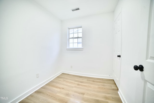 unfurnished bedroom featuring visible vents, baseboards, and light wood-style floors
