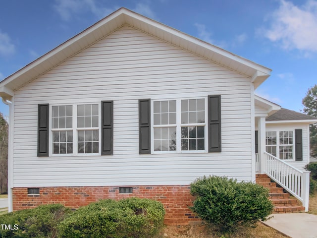 view of side of home with crawl space