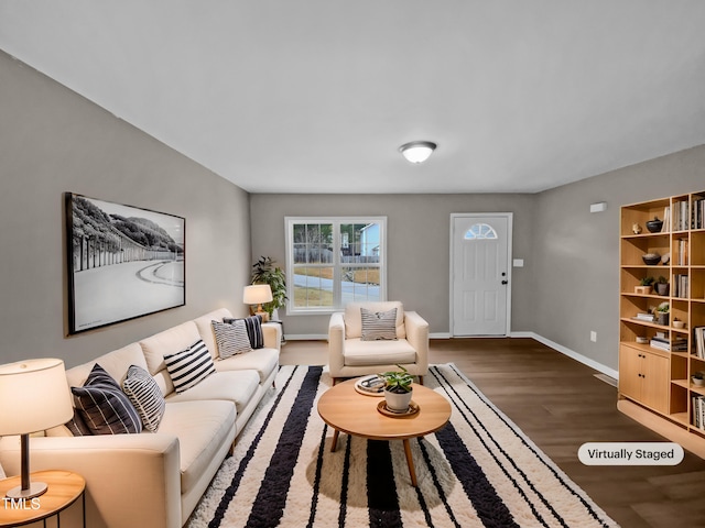 living room featuring dark wood finished floors and baseboards