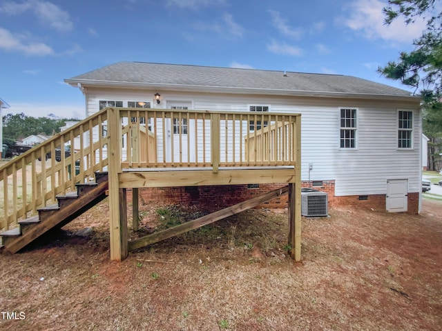 rear view of house featuring a wooden deck, a shingled roof, crawl space, central AC unit, and stairs