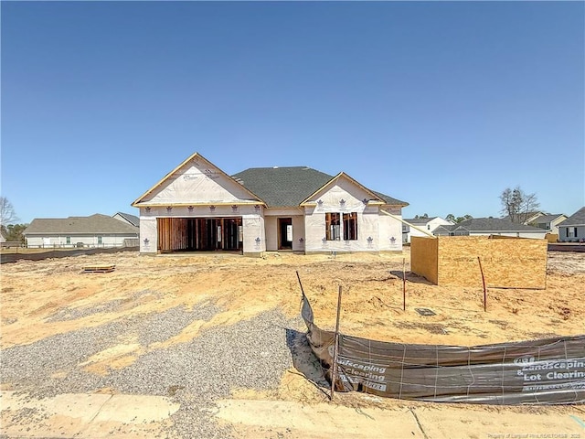 property under construction featuring fence and an attached garage