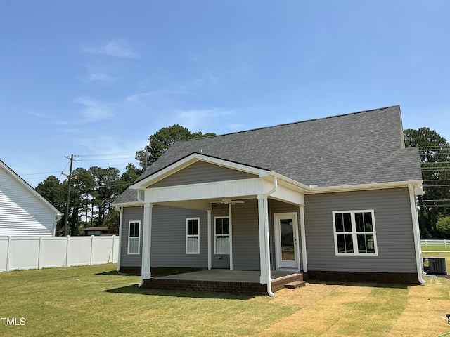 1039 N Lincoln St, Benson, NC 27504 - rear view of house featuring a shingled roof and a patio area