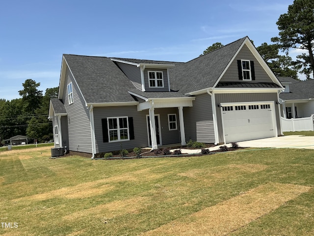 1039 N Lincoln St, Benson, NC 27504 - view of front of home with concrete driveway, a front yard, and roof with shingles