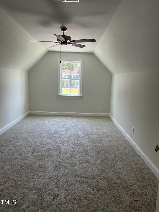 1039 N Lincoln St, Benson, NC 27504 - additional living space with vaulted ceiling, a ceiling fan, and carpet
