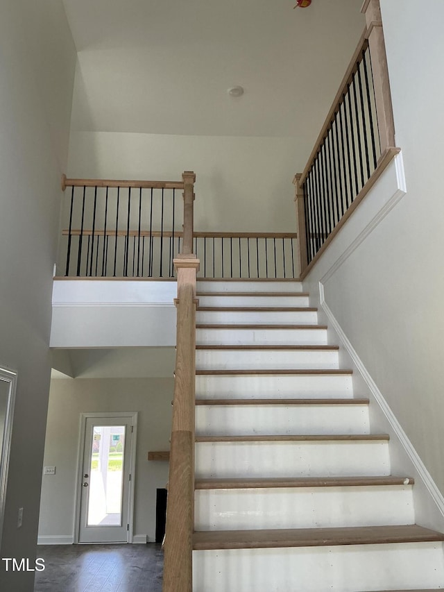1039 N Lincoln St, Benson, NC 27504 - staircase with baseboards and wood finished floors