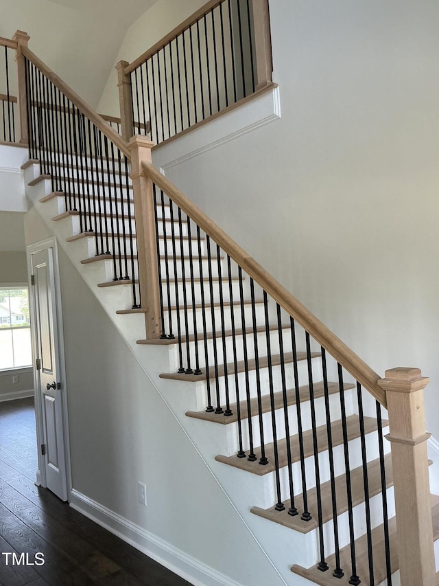 1039 N Lincoln St, Benson, NC 27504 - staircase with wood-type flooring and a high ceiling